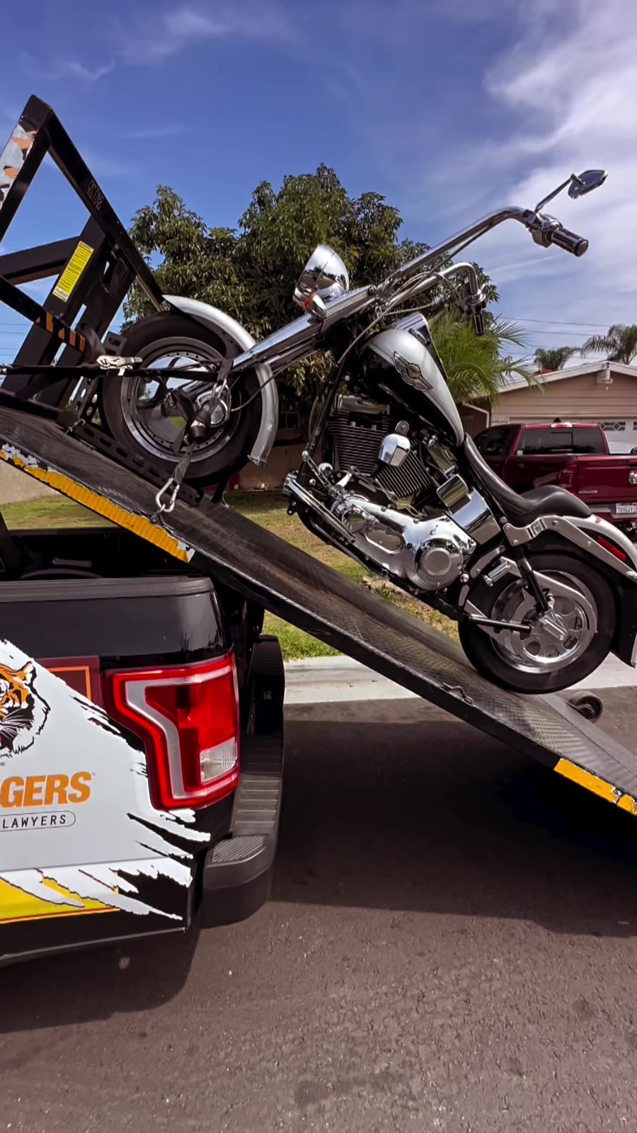 Cruiser loading on Law Tigers branded black truck lift